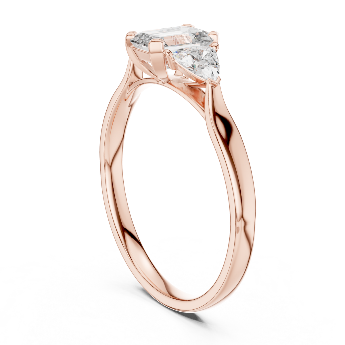 emerald cut three stone engagement ring with trillion side stones