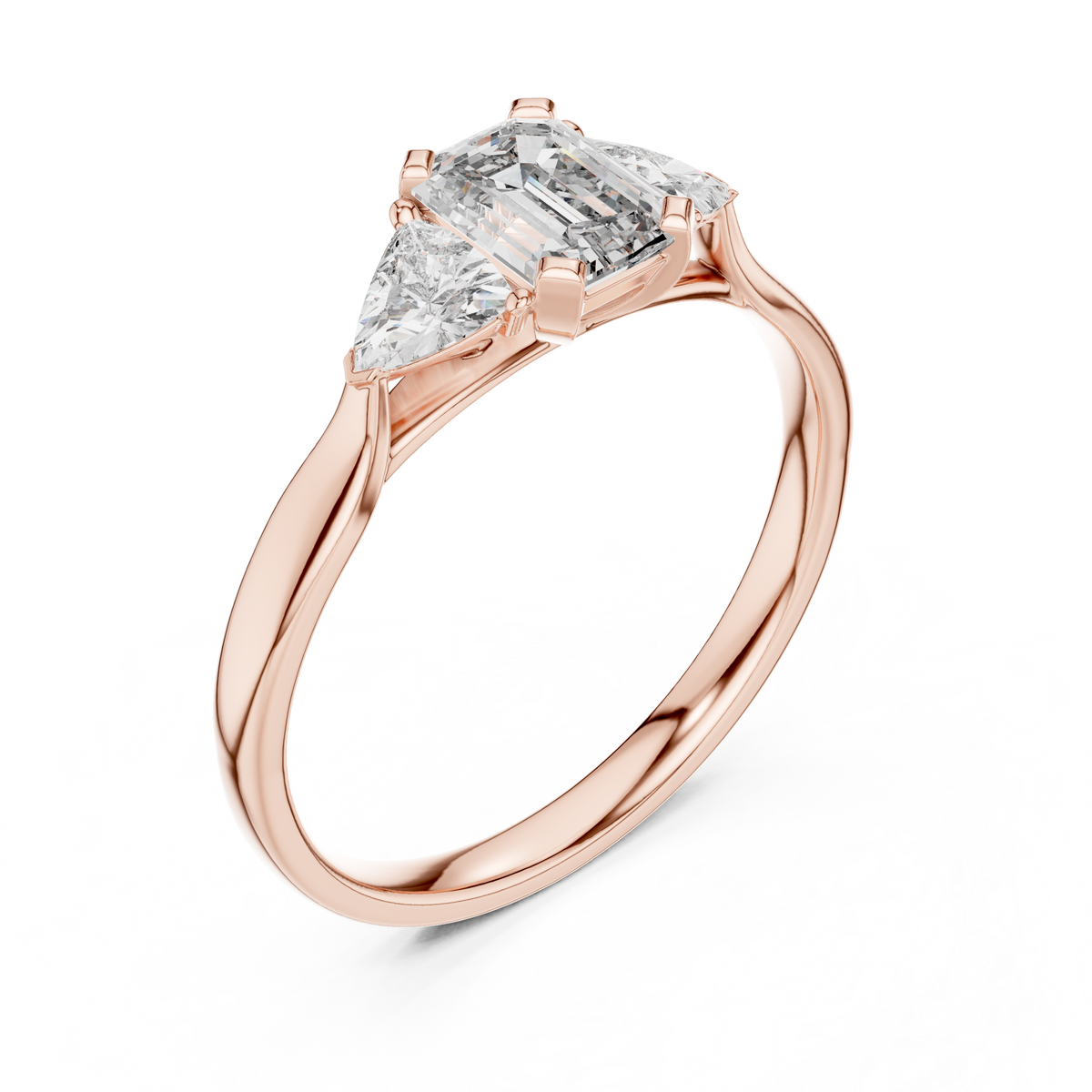 emerald cut three stone engagement ring with trillion side stones