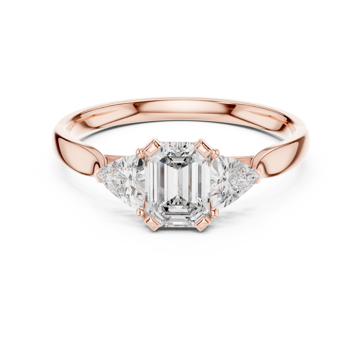 emerald cut three stone engagement ring with trillion side stones