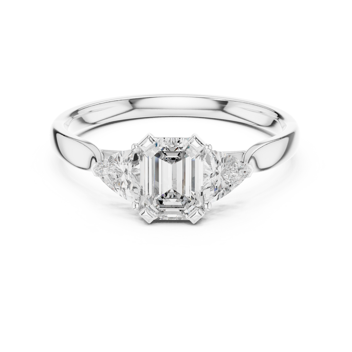 emerald cut three stone engagement ring with trillion side stones