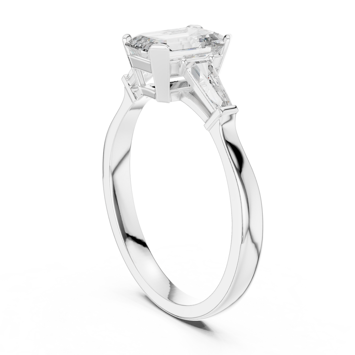 emerald solitaire with tapered baguette engagement ring