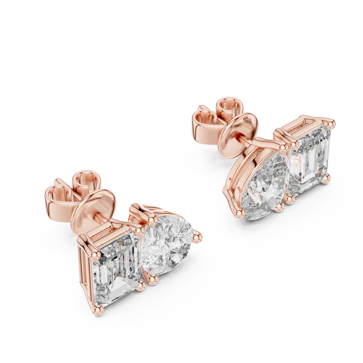 "toi et moi" style diamond stud earrings emerald diamond pear diamond