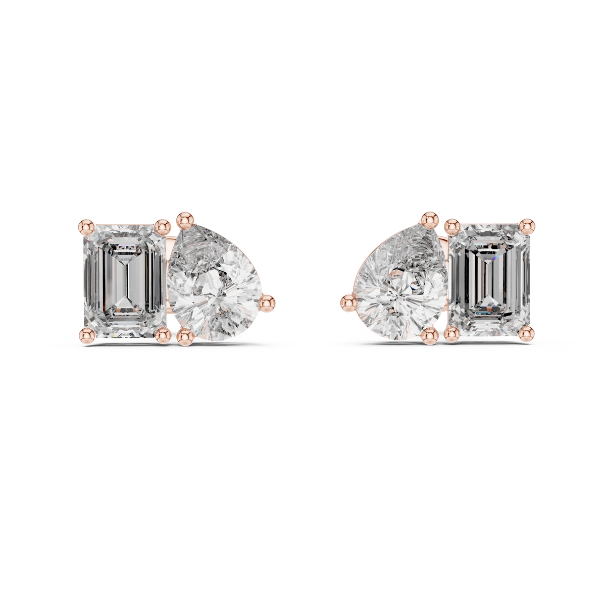 "toi et moi" style diamond stud earrings emerald diamond pear diamond