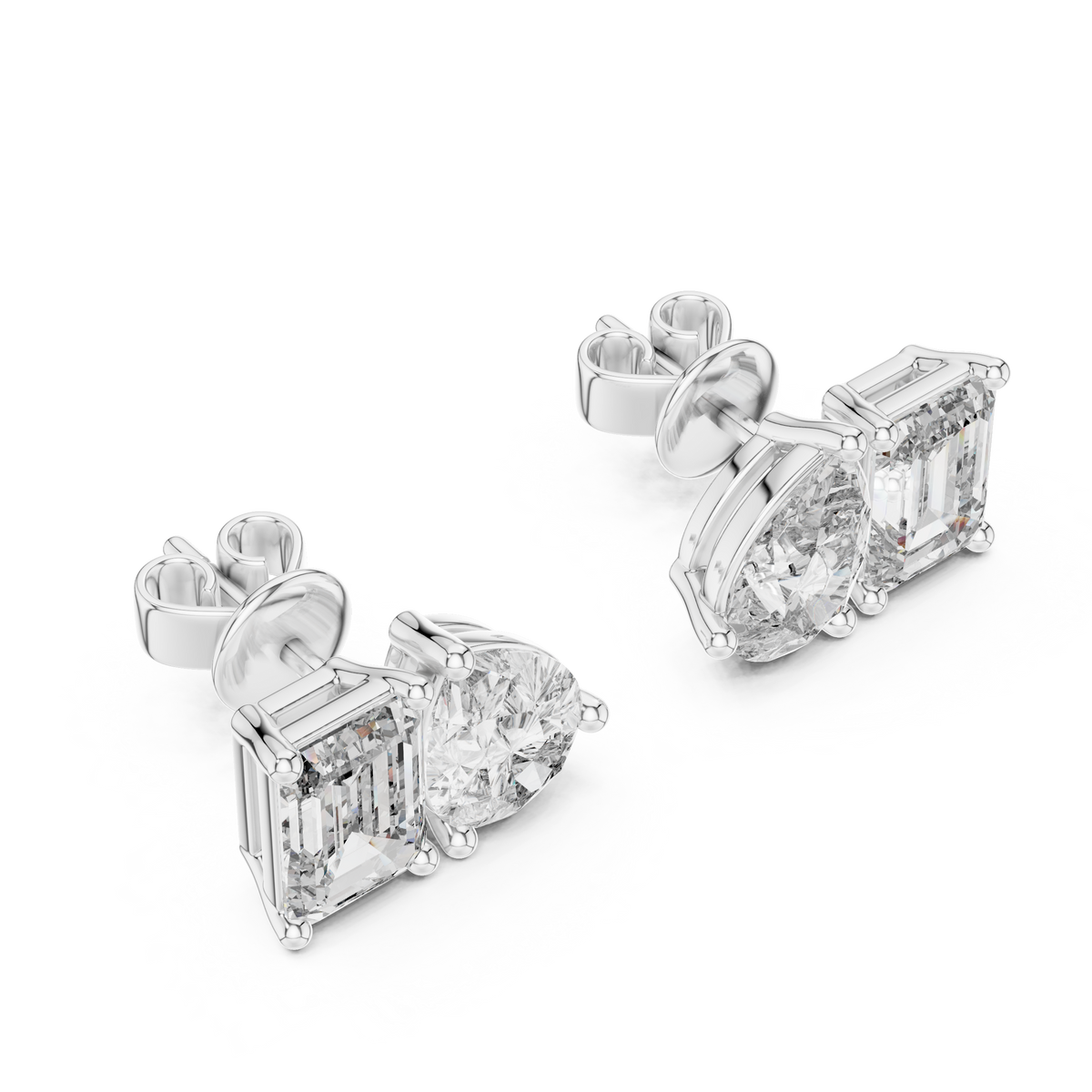"toi et moi" style diamond stud earrings emerald diamond pear diamond