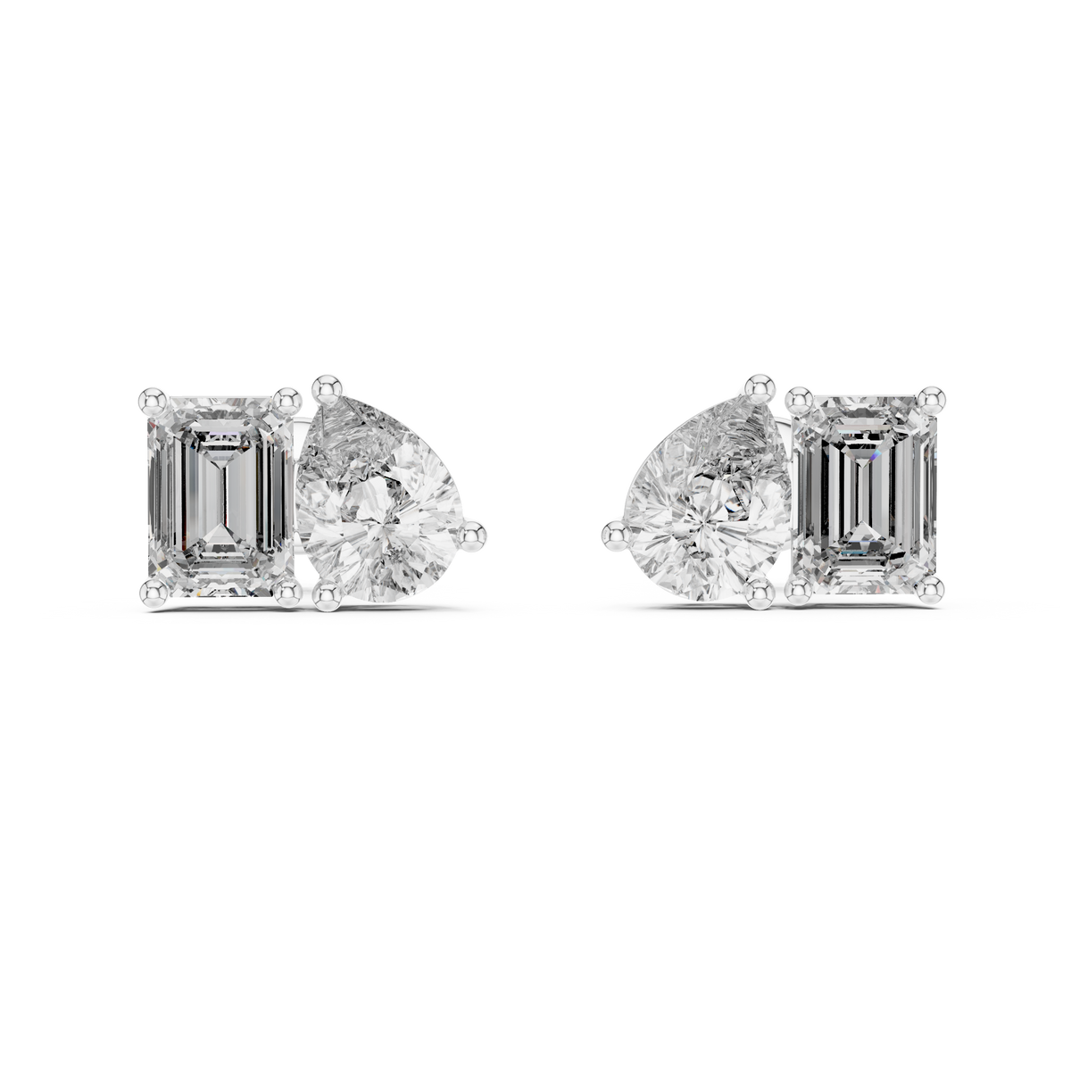 "toi et moi" style diamond stud earrings emerald diamond pear diamond