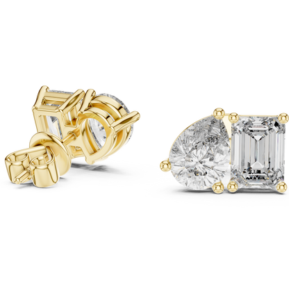 "Toi et Moi" style diamond stud earrings emerald diamond pear diamond
