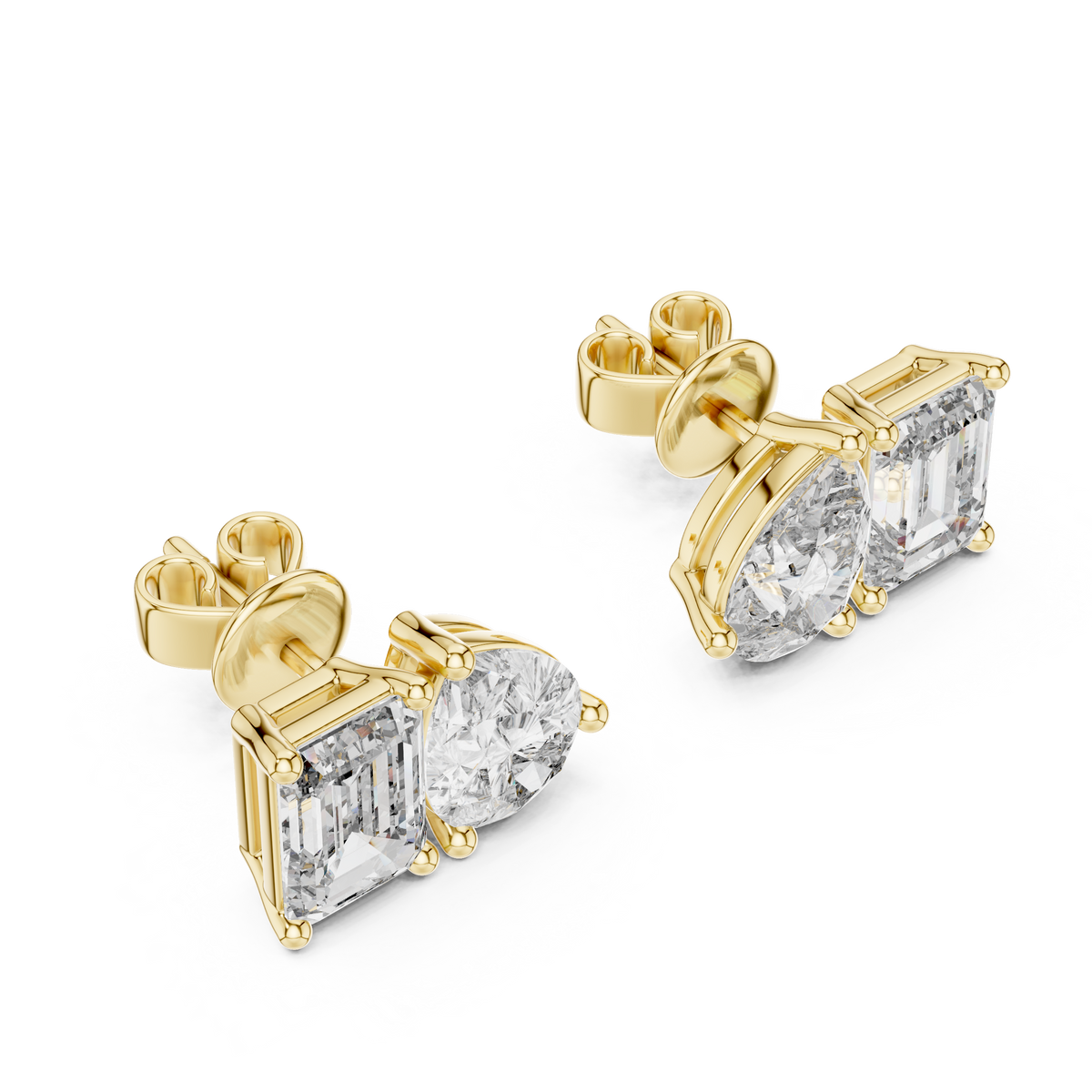 "toi et moi" style diamond stud earrings emerald diamond pear diamond