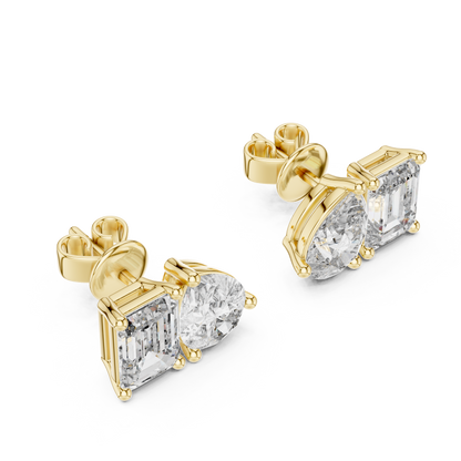 "Toi et Moi" style diamond stud earrings emerald diamond pear diamond