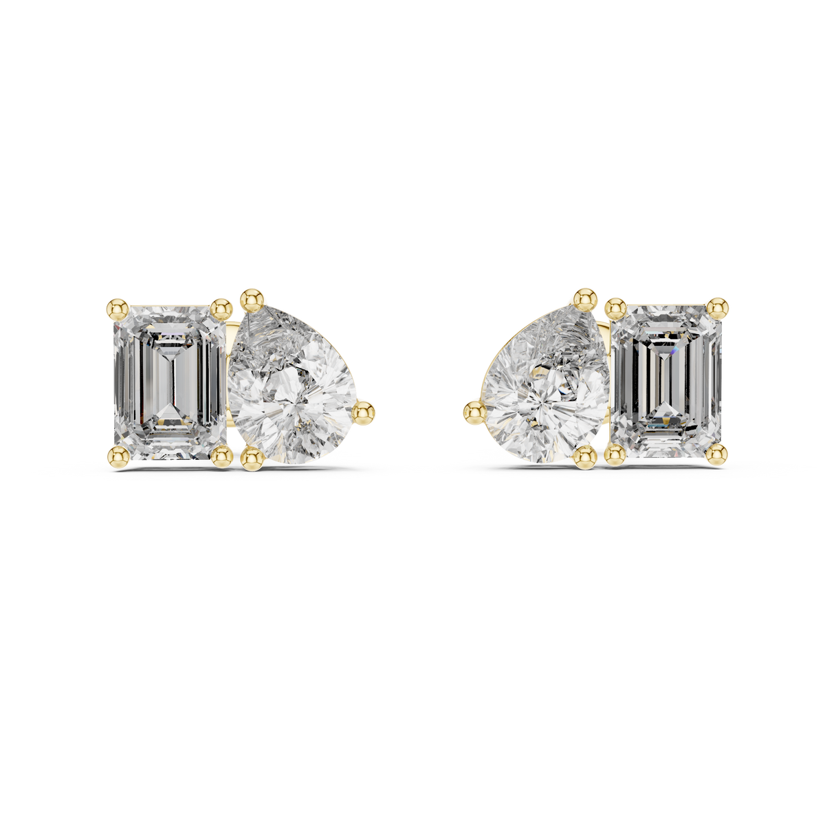 "toi et moi" style diamond stud earrings emerald diamond pear diamond