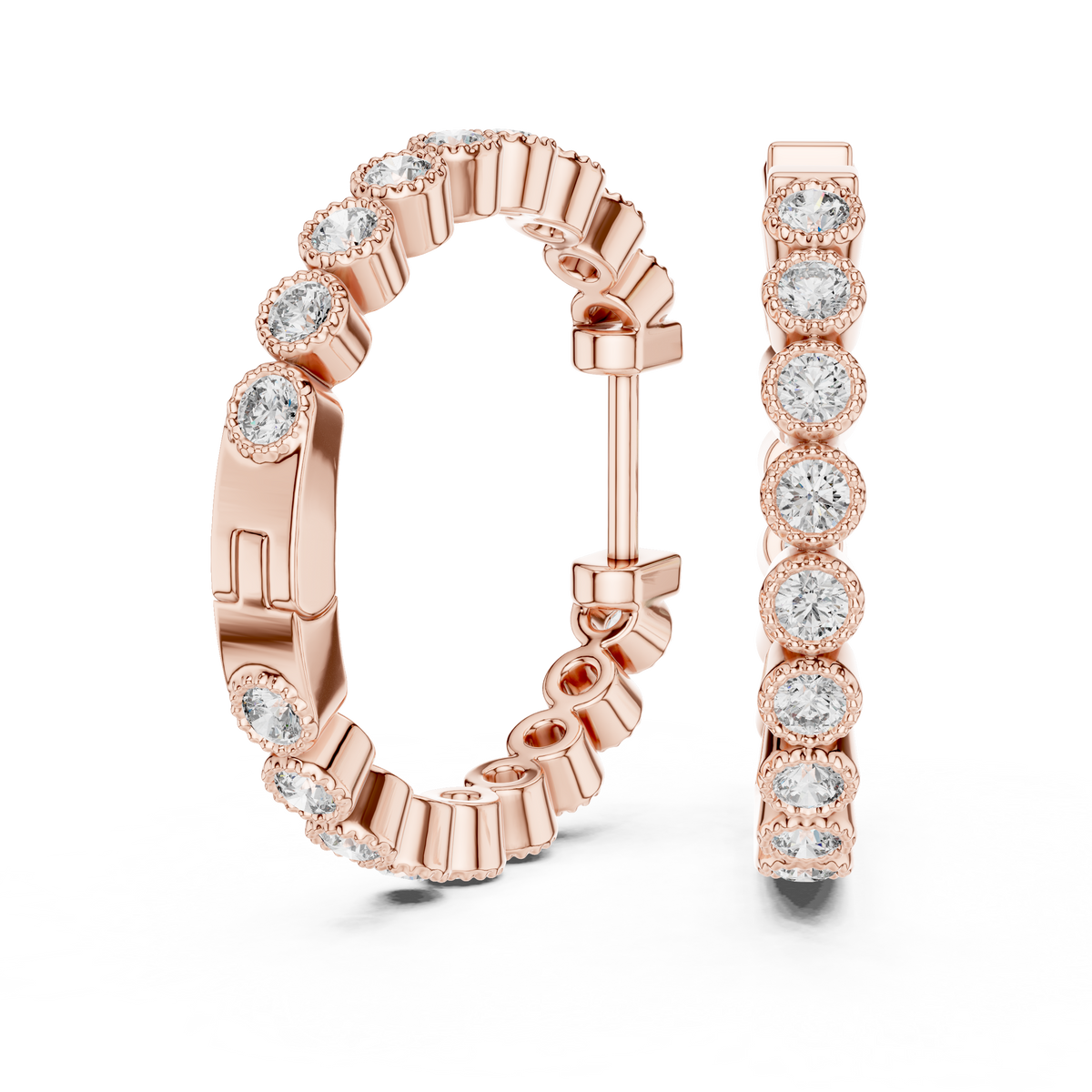 vintage-style round bezel-set diamond inside-out hoop earrings.  each hoop features a continuous line of individually bezel-set round brilliant-cut diamonds outlined with delicate milgrain beaded trim.