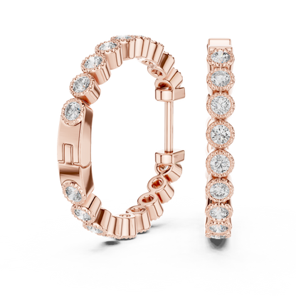 vintage-style round bezel-set diamond inside-out hoop earrings.  each hoop features a continuous line of individually bezel-set round brilliant-cut diamonds outlined with delicate milgrain beaded trim.