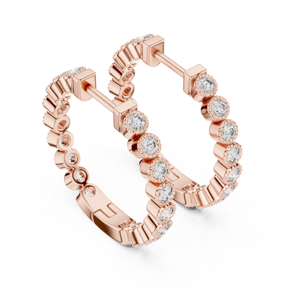 vintage-style round bezel-set diamond inside-out hoop earrings.  each hoop features a continuous line of individually bezel-set round brilliant-cut diamonds outlined with delicate milgrain beaded trim.