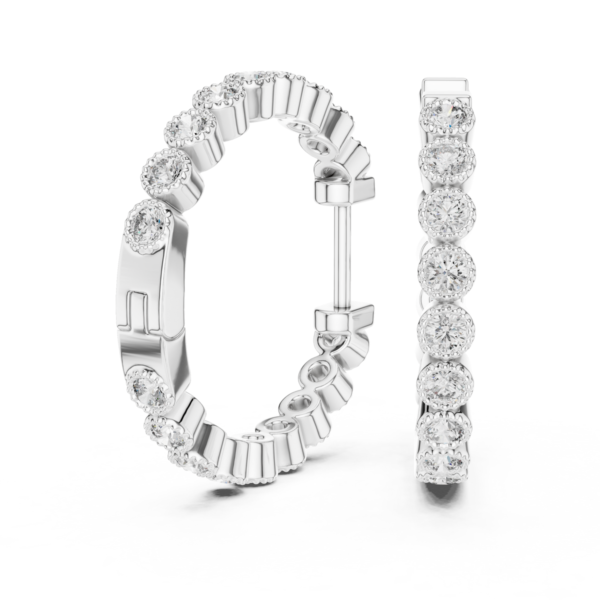 vintage-style round bezel-set diamond inside-out hoop earrings.  each hoop features a continuous line of individually bezel-set round brilliant-cut diamonds outlined with delicate milgrain beaded trim.