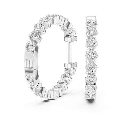 vintage-style round bezel-set diamond inside-out hoop earrings.  each hoop features a continuous line of individually bezel-set round brilliant-cut diamonds outlined with delicate milgrain beaded trim.