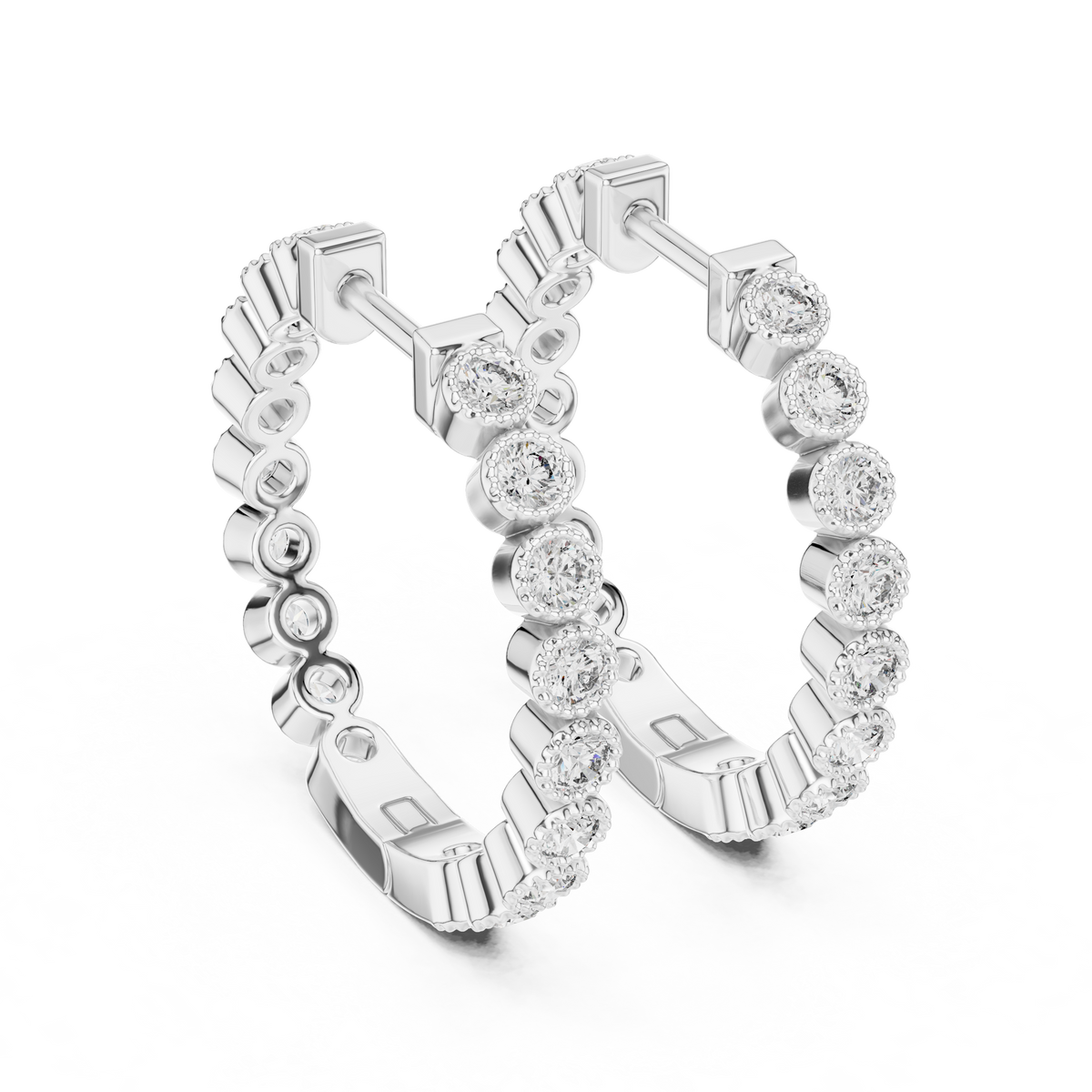 vintage-style round bezel-set diamond inside-out hoop earrings.  each hoop features a continuous line of individually bezel-set round brilliant-cut diamonds outlined with delicate milgrain beaded trim.