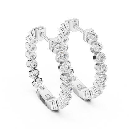 vintage-style round bezel-set diamond inside-out hoop earrings.  each hoop features a continuous line of individually bezel-set round brilliant-cut diamonds outlined with delicate milgrain beaded trim.