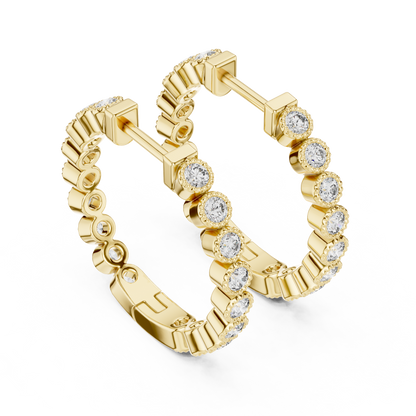 vintage-style round bezel-set diamond inside-out hoop earrings.  each hoop features a continuous line of individually bezel-set round brilliant-cut diamonds outlined with delicate milgrain beaded trim.