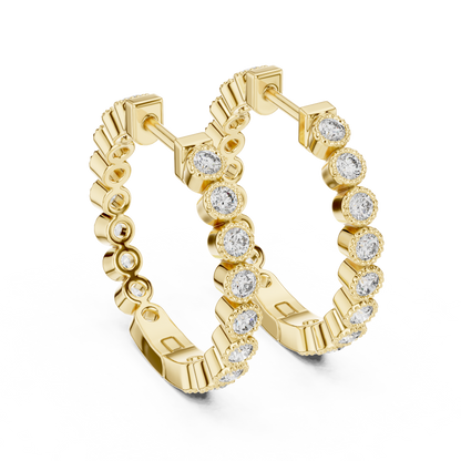 vintage-style round bezel-set diamond inside-out hoop earrings.  each hoop features a continuous line of individually bezel-set round brilliant-cut diamonds outlined with delicate milgrain beaded trim.